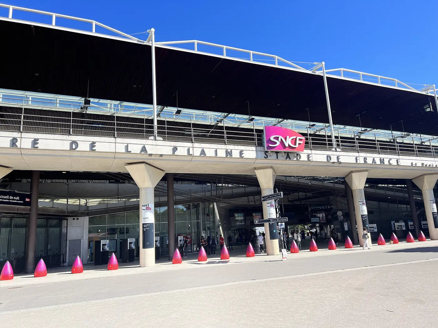Facade of La Plaine – Stade de France station with SNCF signage, the main RER B station serving the stadium.